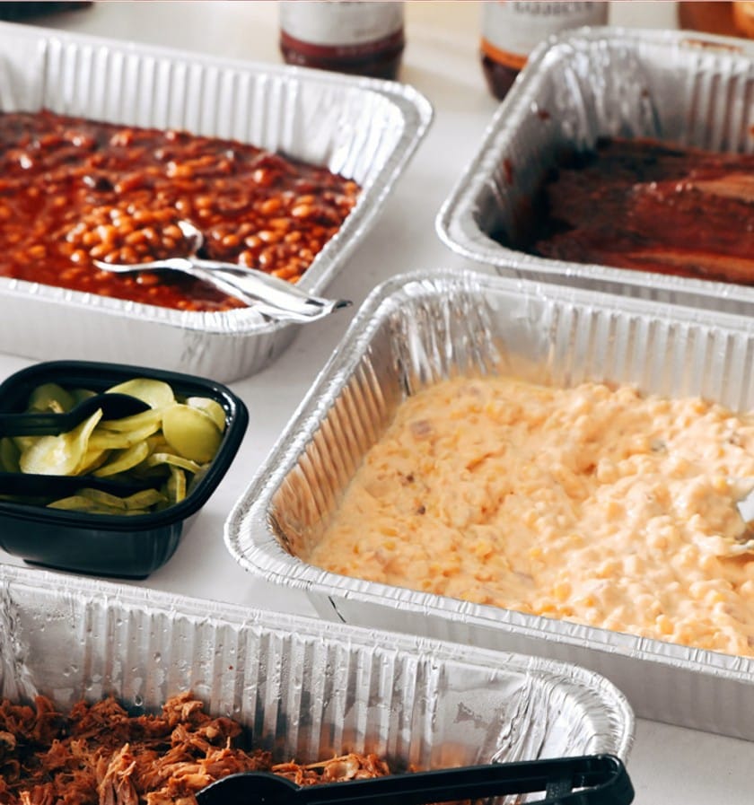 Jack Stack catering food such as pulled pork, pit beans and cheesy corn bake